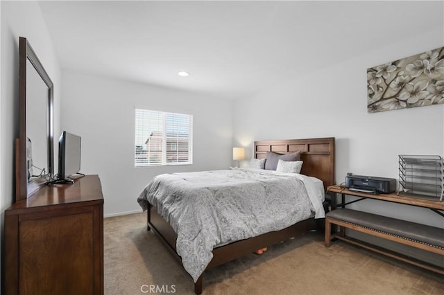 bedroom with light colored carpet