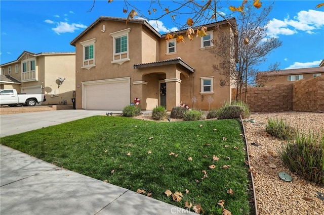 view of front of home with a front yard and a garage