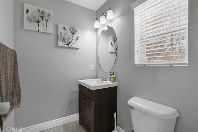 bathroom with tile patterned floors, vanity, and toilet