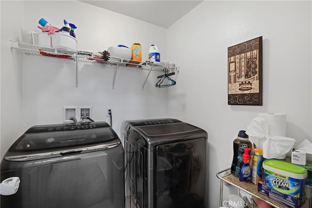 clothes washing area featuring washing machine and clothes dryer