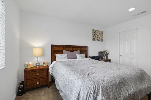 bedroom with dark carpet