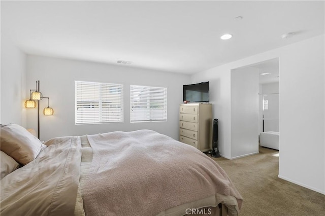 bedroom with light colored carpet