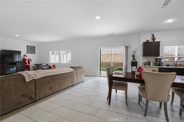 dining room with sink and light tile patterned floors