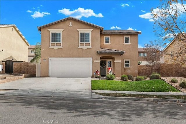 view of front of property featuring a garage and a front lawn