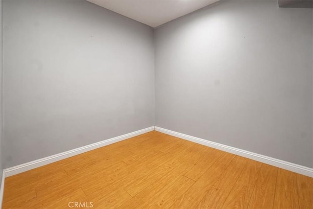 spare room with hardwood / wood-style floors