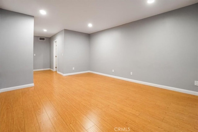 spare room with light hardwood / wood-style flooring