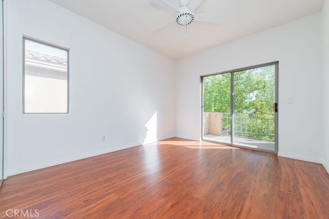 empty room with ceiling fan and hardwood / wood-style floors