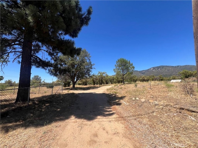 view of road featuring a rural view and a mountain view