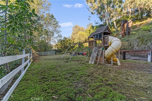 view of play area with a yard