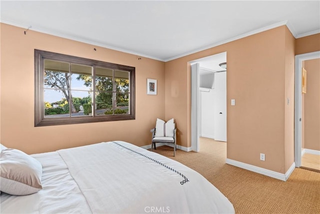 bedroom featuring ornamental molding and light colored carpet