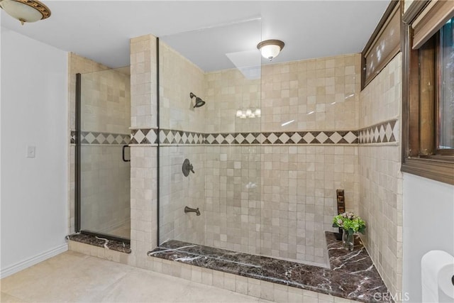 bathroom featuring an enclosed shower and tile patterned flooring