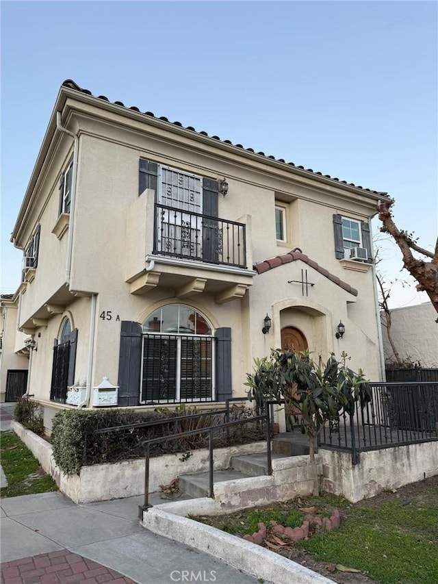 view of front of house with a balcony