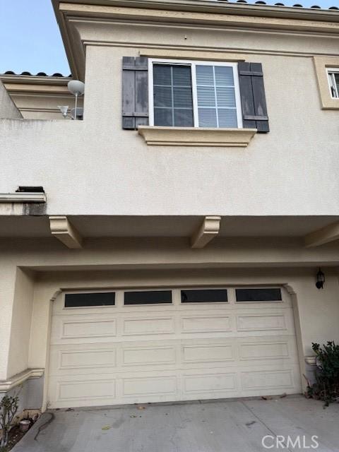 view of side of property featuring a garage