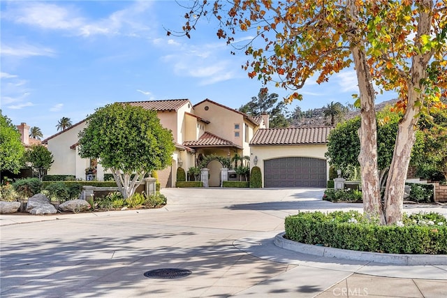 mediterranean / spanish house with a garage