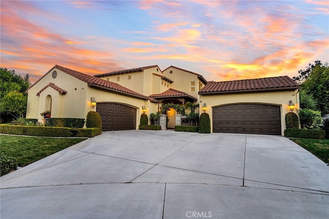 mediterranean / spanish-style house featuring a garage