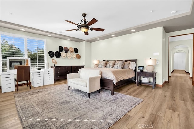 bedroom featuring ceiling fan and light hardwood / wood-style floors