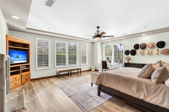 bedroom with ceiling fan and light hardwood / wood-style flooring