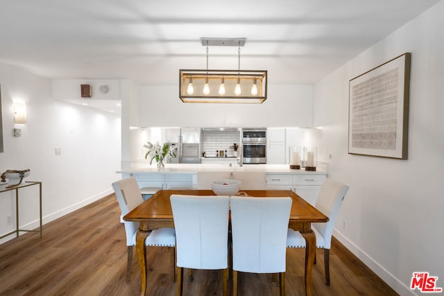 dining room with dark hardwood / wood-style flooring