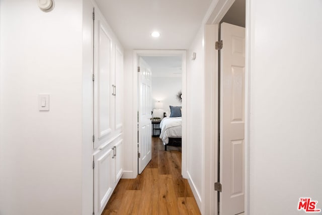 corridor featuring light hardwood / wood-style floors