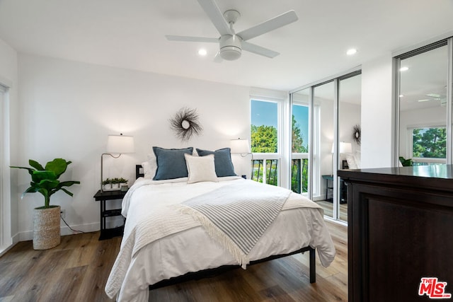 bedroom with ceiling fan, a closet, and hardwood / wood-style flooring