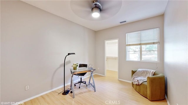 office with ceiling fan and light wood-type flooring