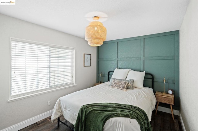 bedroom featuring dark hardwood / wood-style floors