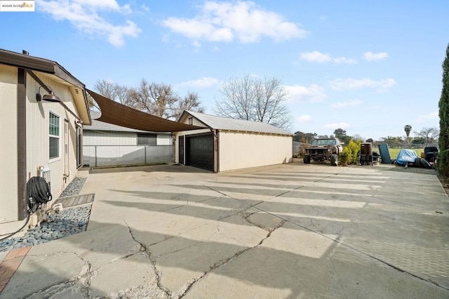 exterior space with a garage and an outdoor structure