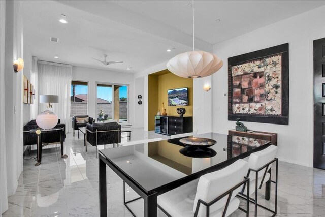 dining room featuring ceiling fan