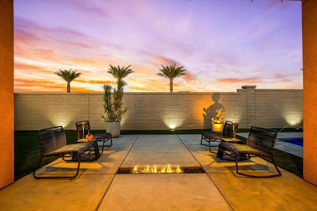 view of patio terrace at dusk