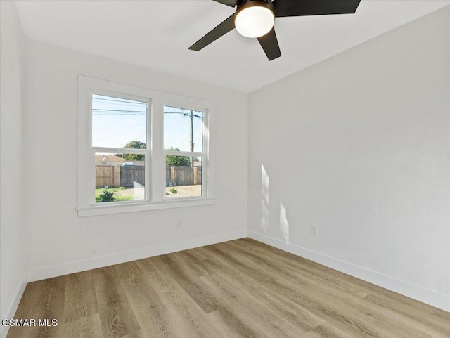 unfurnished room featuring ceiling fan and light wood-type flooring