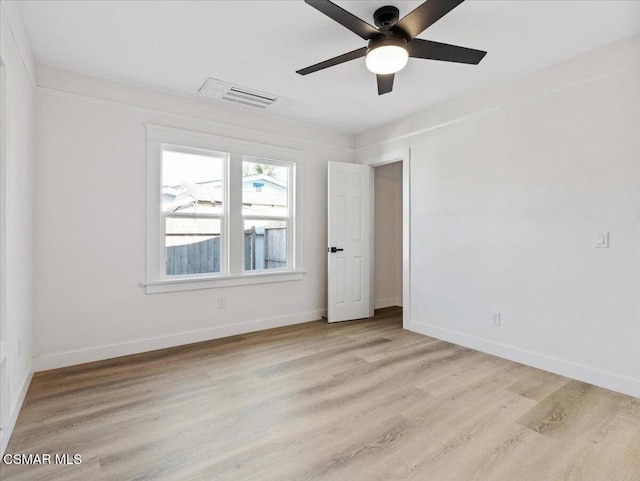 unfurnished room featuring light hardwood / wood-style floors and ceiling fan