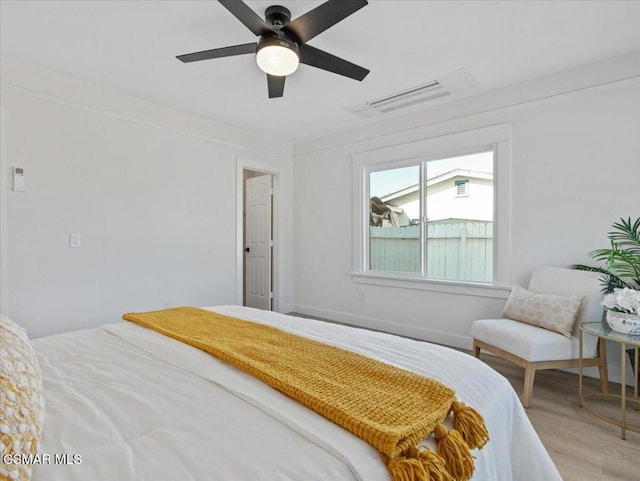 bedroom featuring ceiling fan and hardwood / wood-style flooring