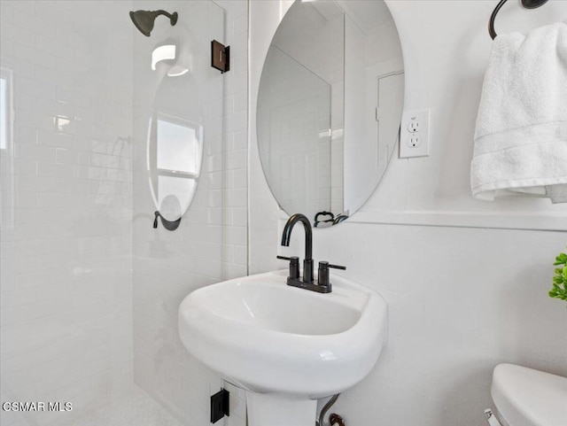 bathroom featuring sink and toilet