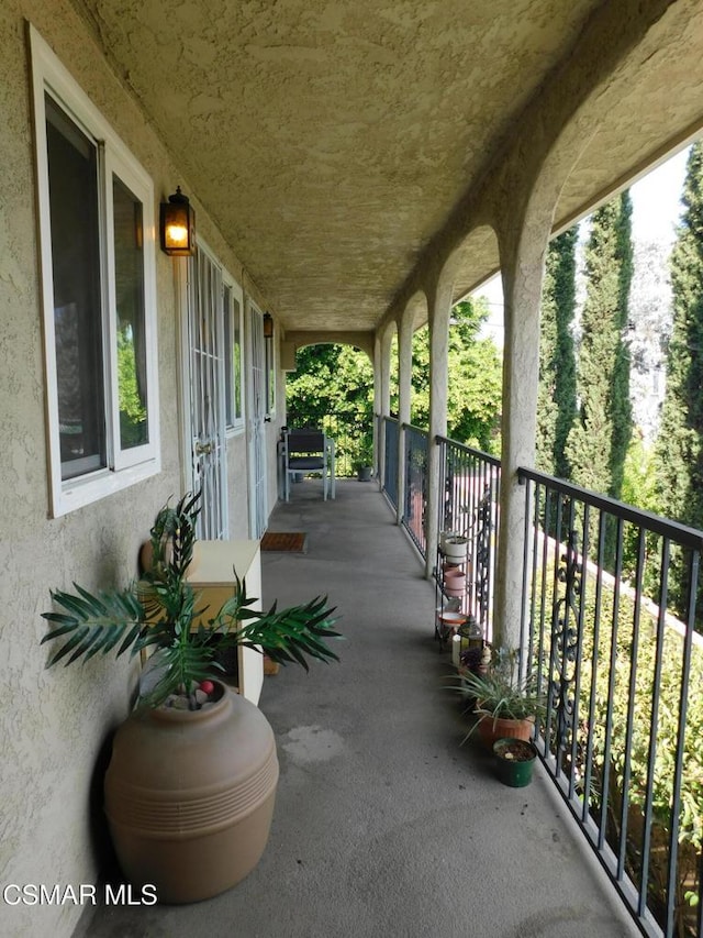 view of patio / terrace with a balcony