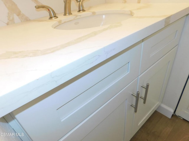 bathroom featuring hardwood / wood-style floors and vanity