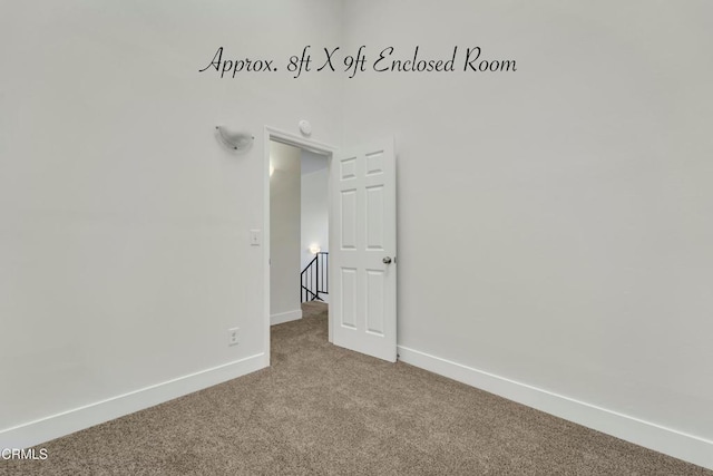 unfurnished room with carpet