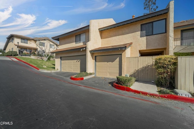 townhome / multi-family property featuring a garage