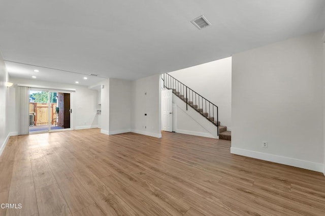 unfurnished living room featuring light wood-type flooring