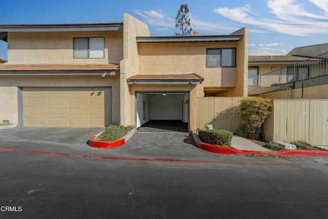 townhome / multi-family property featuring a garage