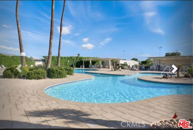 view of pool featuring a patio area