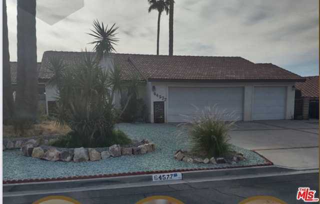 ranch-style home with a garage