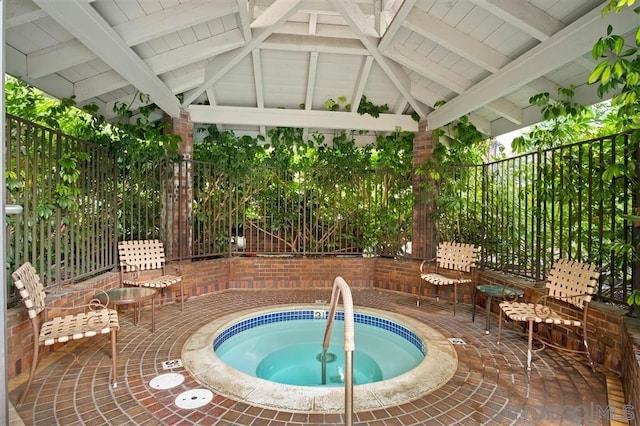 view of pool with a gazebo, a patio area, and a community hot tub