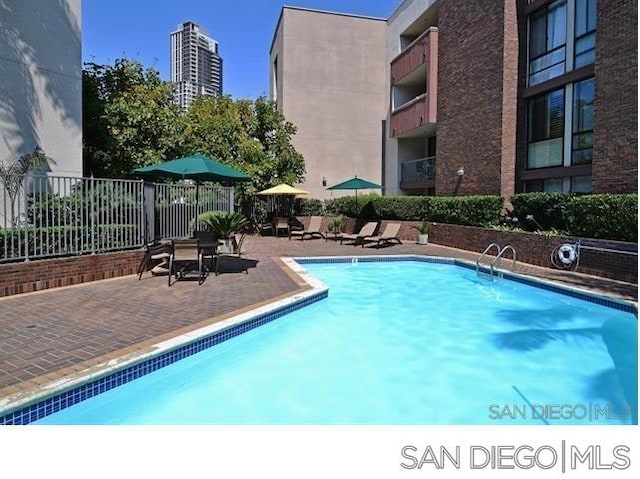 view of swimming pool featuring a patio area