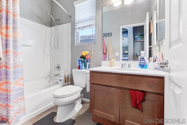 full bathroom with toilet, shower / tub combo, and vanity