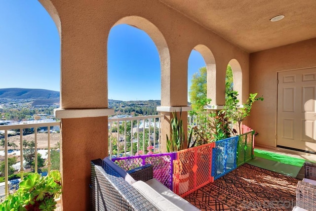 balcony featuring a mountain view