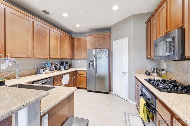 kitchen with sink and black appliances