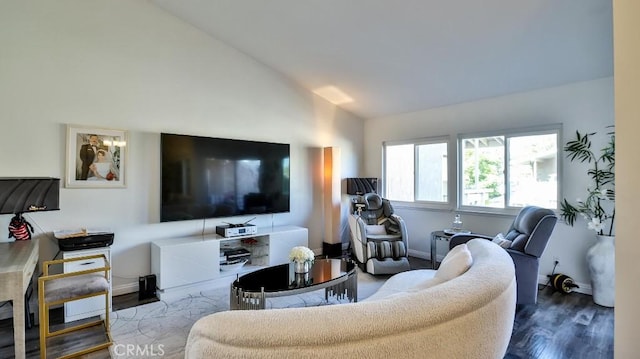 living room with dark hardwood / wood-style floors and lofted ceiling