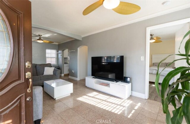 living room featuring crown molding