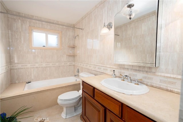 full bathroom featuring toilet, shower / bathing tub combination, tile walls, tile patterned floors, and vanity