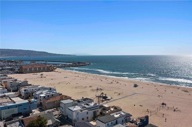 aerial view with a water view and a view of the beach